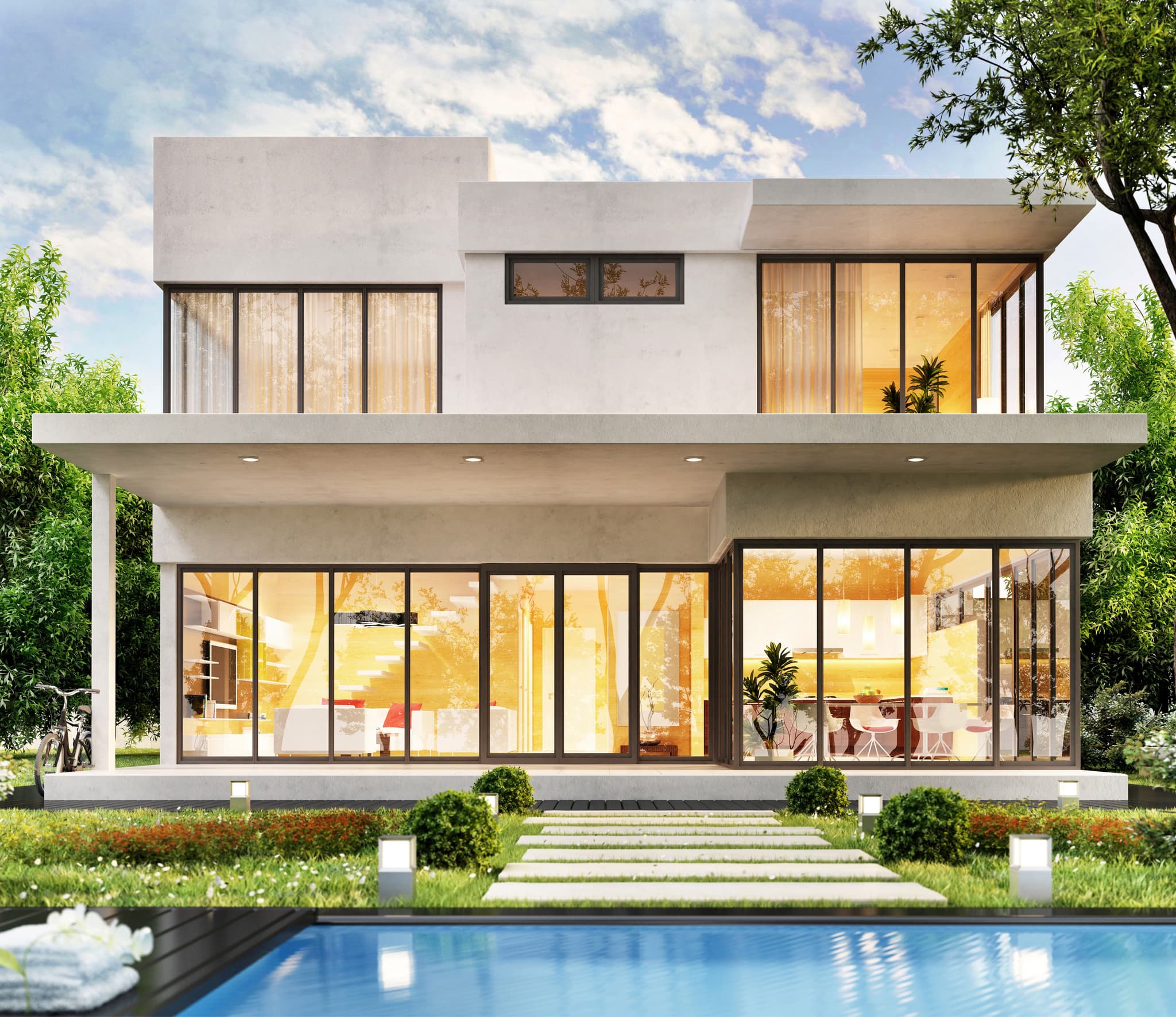 Luxury lounge framed by uPVC & Aluminium glass doors overlooking a pool at dusk