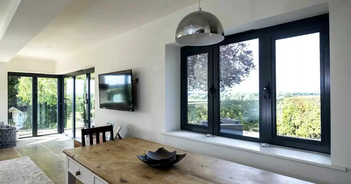 Aluminium casement window opened outward on a building exterior