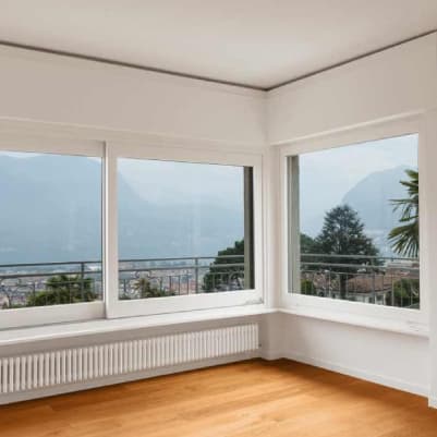 Corner uPVC sliding windows with a mountain view