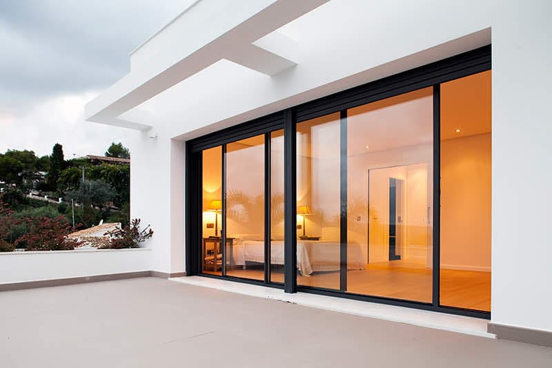 Full-height uPVC sliding doors opening onto a golf course view